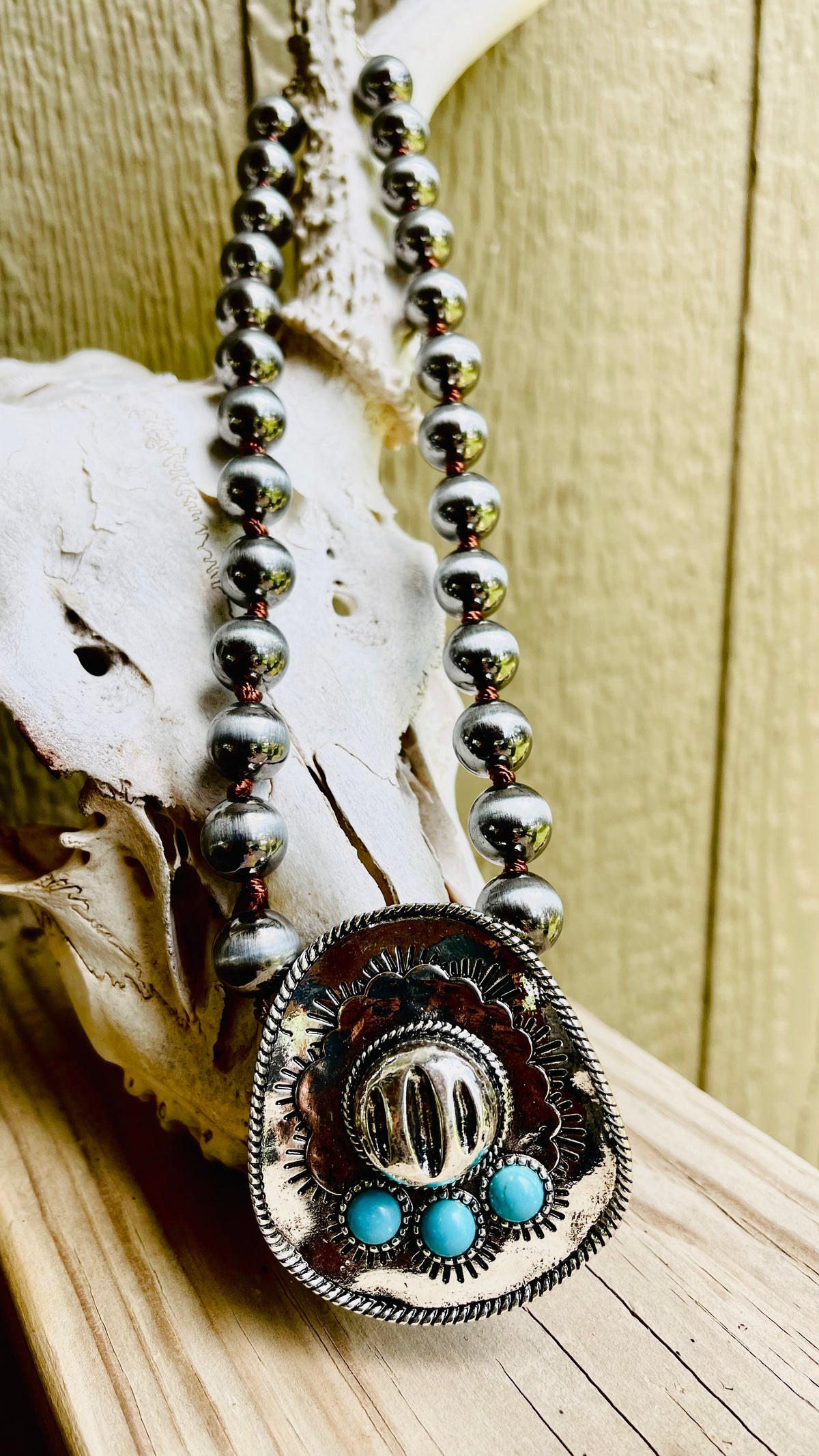 Western Turquoise Cowboy Hat
Pearl Necklace