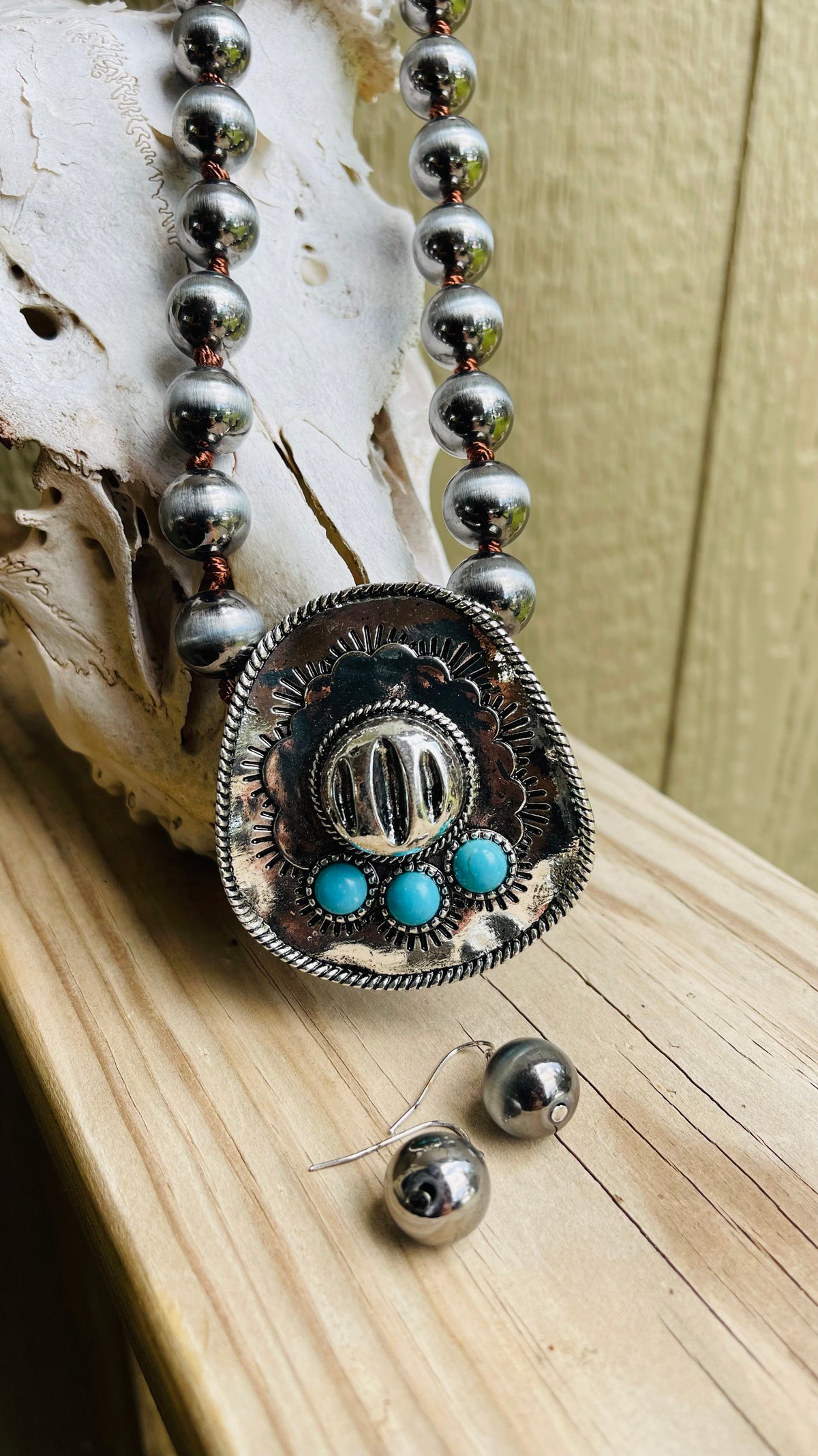 Western Turquoise Cowboy Hat
Pearl Necklace